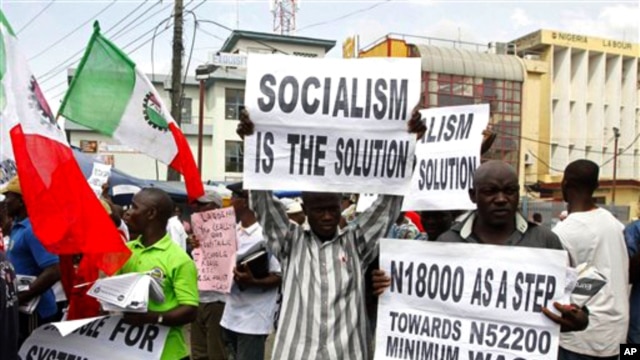 Trade union members display placards during a protest, in Lagos, Nigeria, Nov 10, 2010
