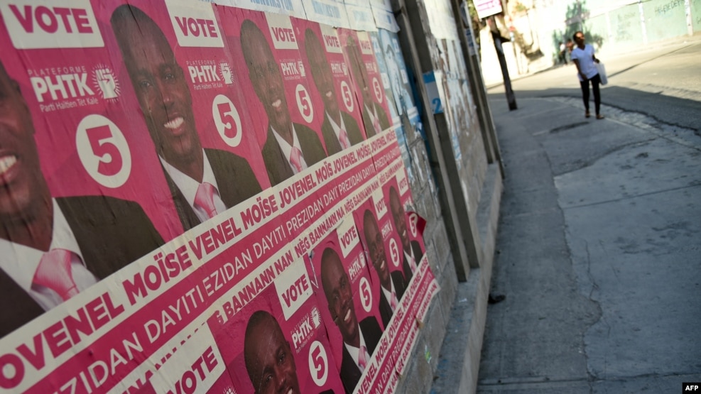 FILE - Election posters of presidential candidate Jovenel Moise of PHTK political Party are seen on a wall in Port-au-Prince, Dec. 22, 2015.