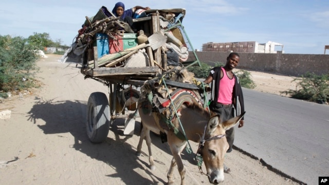 FILE - Somalis are seen leaving the Somali capital Mogadishu, due to hunger, for a refugee camp.