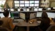 Technicians monitor data flow in the control room of an internet service provider in Tehran, Iran, Feb. 15, 2011. 