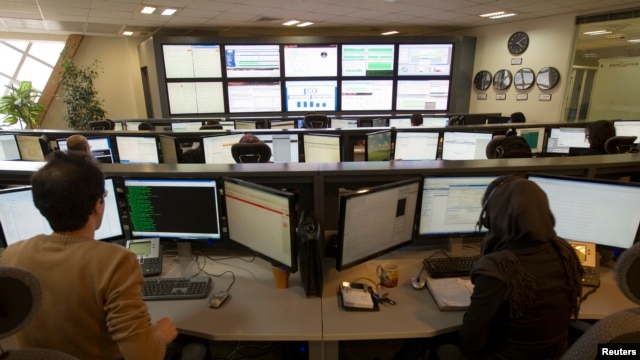 Technicians monitor data flow in the control room of an internet service provider in Tehran, Iran, Feb. 15, 2011.