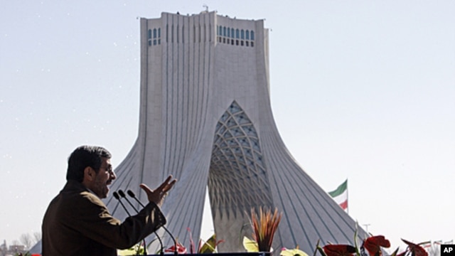 Iranian President Mahmoud Ahmadinejad gestures as he deliver his speech near the Azadi (freedom) tower at a rally to mark the 33rd anniversary of the Islamic Revolution that toppled the country's pro-Western monarchy and brought Islamic clerics to power, 