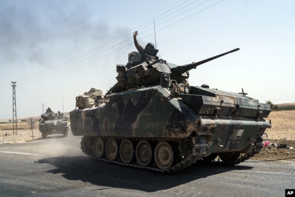 Turkish troops head to the Syrian border, in Karkamis, Turkey, Aug. 27, 2016.