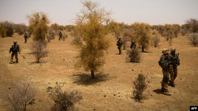 FILE - A photo taken on April 10, 2013 shows French soldiers taking part, 105 kms north of the northeastern Malian city of Gao, in an operation to find Islamist fighters. 