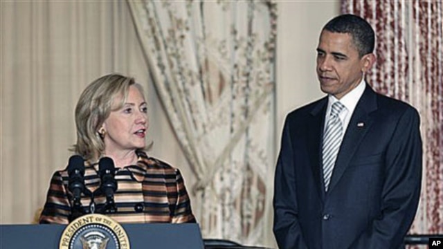 President Barack Obama is introduced by Secretary of State Hillary Rodham Clinton at a holiday reception for international diplomats at the State Department in Washington, where they praised the work of the late Amb. Richard Holbrooke, Dec 13, 2010