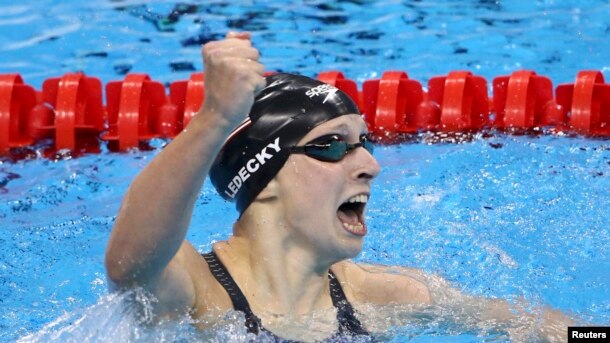 Katie Ledecky (USA) of USA celebrates after setting a new world record.