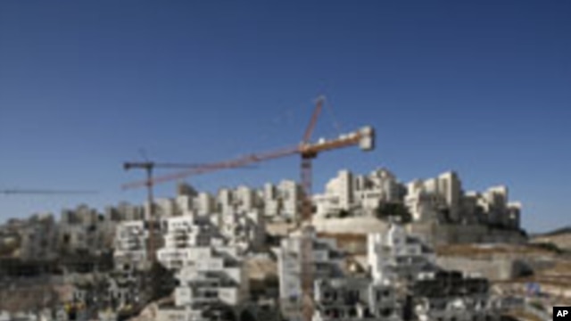 Houses under construction are seen in a Jewish settlement near Jerusalem known to Israelis as Har Homa and to Palestinians as Jabal Abu Ghneim, 08 Dec 2010