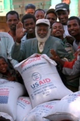 A man receives 50 kilograms of US sorghum in southern Ethiopia during 2010.