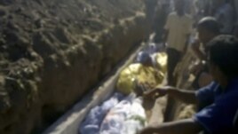 This image made from amateur video on July 13, 2012 purports to show a funeral for victims killed by violence that, according to anti-regime activists, was carried out by government forces in Tremseh, Syria.