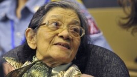 In this photo taken on Oct. 19, 2011 released by the Extraordinary Chambers in the Courts of Cambodia, Ieng Thirith smiles during a hearing in Phnom Penh.