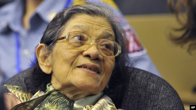 In this photo taken on Oct. 19, 2011 released by the Extraordinary Chambers in the Courts of Cambodia, Ieng Thirith smiles during a hearing in Phnom Penh.