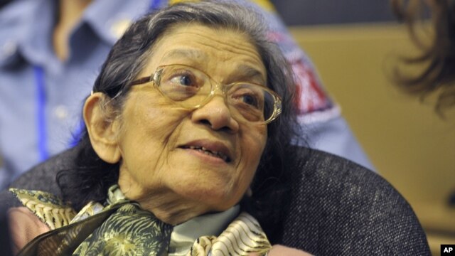 In this photo taken on OctOBER 19, 2011 and released by the Extraordinary Chambers in the Courts of Cambodia, Ieng Thirith smiles during a hearing in Phnom Penh.