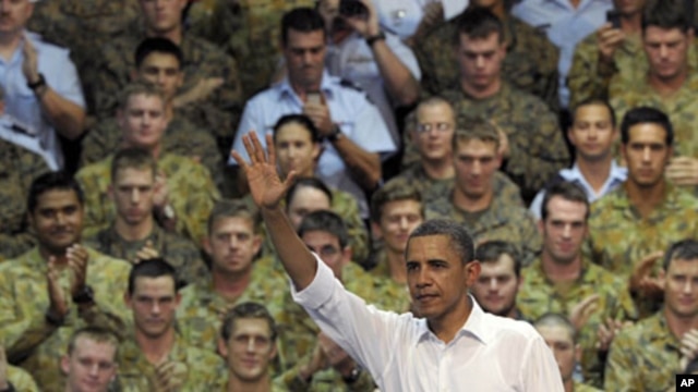 U.S. President Barack Obama waves to the troops after speaking at the Royal Army Air Force Base in Darwin, Australia, November 17, 2011.