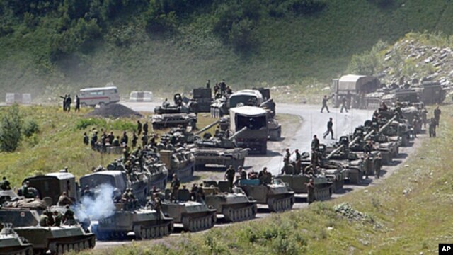 A column of Russian armored vehicles on its way to the South Ossetian capital Tskhinvali in the Georgian breakaway region, South Ossetia, August 9, 2008 file photo