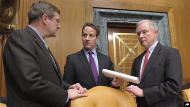 Treasury Secretary Timothy Geithner, center, talks with Senate Budget Committee Chairman Sen. Kent Conrad, D-N.D., left, and the committee's ranking Republican Sen. Jeff Sessions, R-Ala., on Capitol Hill in Washington, Thursday, Feb. 17, 2011.