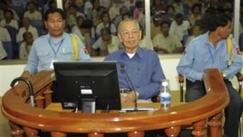 Ieng Sary, center, former Khmer Rouge's foreign affair minister, sits in a court dock of the U.N.-backed genocide tribunal, during a hearing, file photo. 