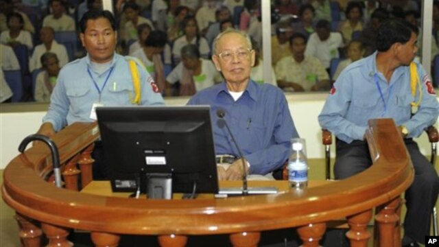 Ieng Sary, center, former Khmer Rouge's foreign affair minister, sits in a court dock of the U.N.-backed genocide tribunal, during a hearing, file photo. 