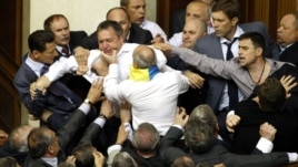 Deputies scuffle during a session in the chamber of the Ukrainian parliament in Kiev May 24, 2012.