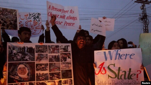 Members of the Hazara community and various non-governmental organizations sit-in during a protest against the twin bomb attack in Quetta, in Lahore, Pakistan, January 12, 2013. 