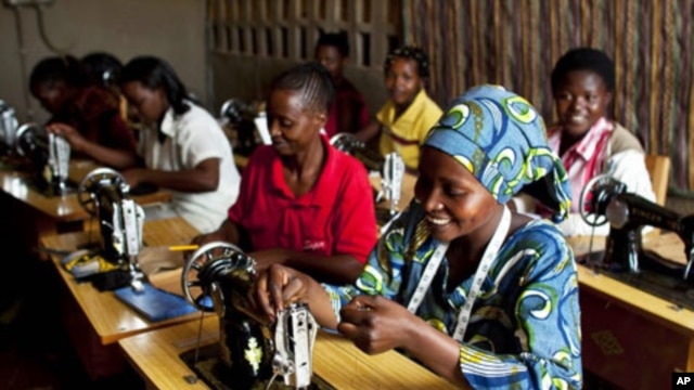 Women who have enrolled in international's programs in Rwanda and the Democratic Republic of the Congo are shown sewing.