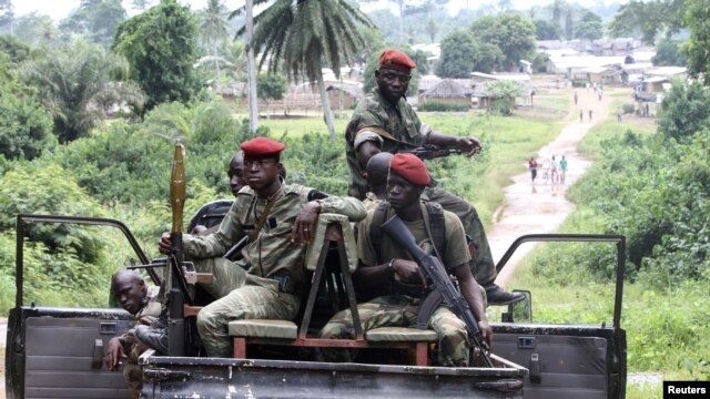 Ivory Coast Republican forces patrol near Sacre village, in the western Tai area near Ivory Coast's border with Liberia, June 17, 2012.