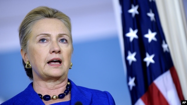 Secretary of State Hillary Clinton answers a reporter's question on Libya during a joint news conference with Brazil's Foreign Minister Antonion de Aguiar Patriota, October 24, 2012, at the State Department in Washington. 