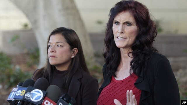 Cindy Lee Garcia, right, and attorney M. Cris Armenta hold a news conference before a hearing at Los Angeles Superior Court in Los Angeles, September 20, 2012.