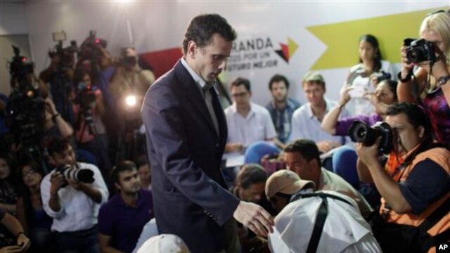 Henrique Capriles arrives for a press conference in Caracas, Venezuela, on March 10, 2013, to announce he will run in elections to replace late President Hugo Chavez.