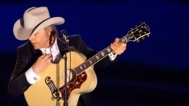 Dwight Yoakam performing at a music awards ceremony in June