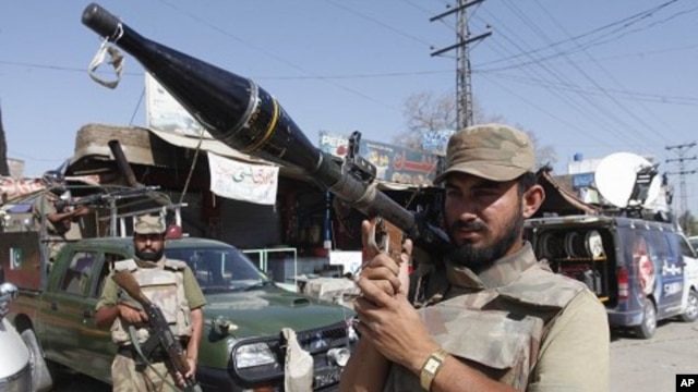 Pakistan army soldiers are on alert at the site of a bombing in Shabqadar near Peshawar, Pakistan (File Photo)