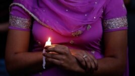 A candle light vigil was held in Milwaukee, Wisconisn for the victims of the Sikh Temple shooting, August 5, 2012.