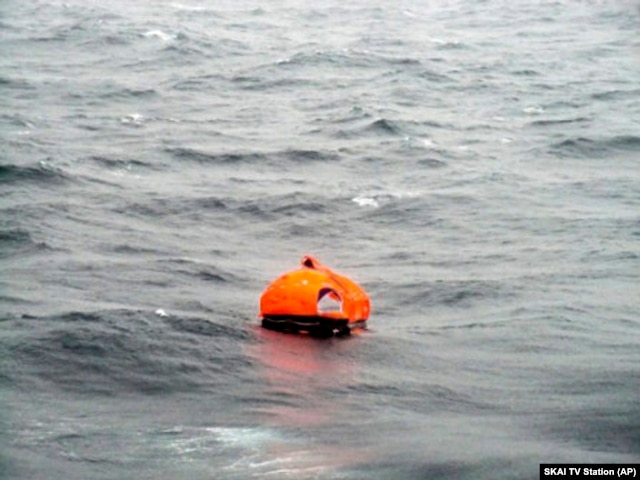 In this photo taken from a nearby boat showing a life raft from the Italian-flagged Norman Atlantic ferry after it caught fire in the Adriatic Sea, Dec. 28, 2014.