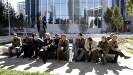 Chinese migrants in Beijing.  Researchers say China's gender imbalance has driven men to larger cities in search of wives. 