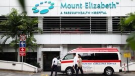 An ambulance is parked outside the Mount Elizabeth Hospital in Singapore, December 27, 2012.