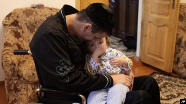 Abzulit Shauxalov, 31, a former policeman, was shot in the back while on duty. Islamic militant violence in Ingushetia has killed 400 police officers over the past five years.