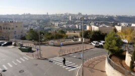 An ultra-Orthodox Jewish man walks in Ramat Shlomo, a religious Jewish settlement in an area of the occupied West Bank, in East Jerusalem, claimed by both Israel and Palestinians, December 18, 2012.