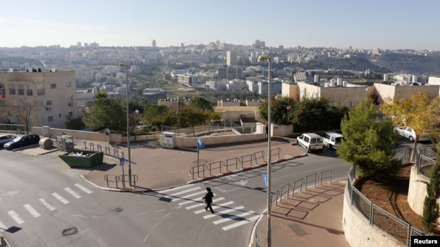 An ultra-Orthodox Jewish man walks in Ramat Shlomo, a religious Jewish settlement in an area of the occupied West Bank, in East Jerusalem, claimed by both Israel and Palestinians, December 18, 2012.