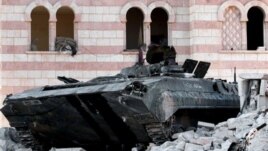 A damaged Syrian military tank is seen at the border town of Azaz, about 20 miles north of Aleppo, Syria, July 24, 2012.