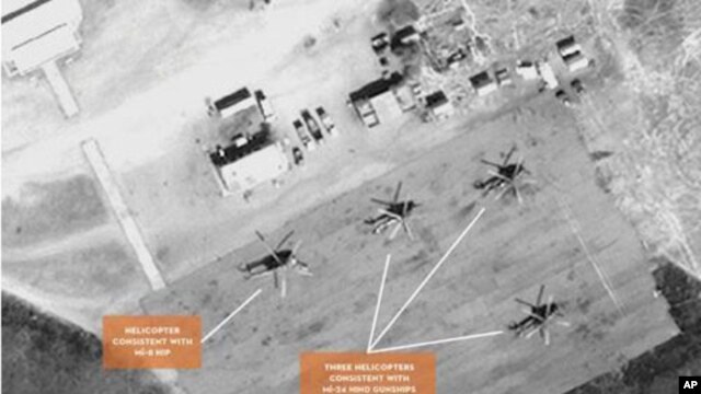 Satellite image of helicopters at the Sudanese airbase at Kidugli.