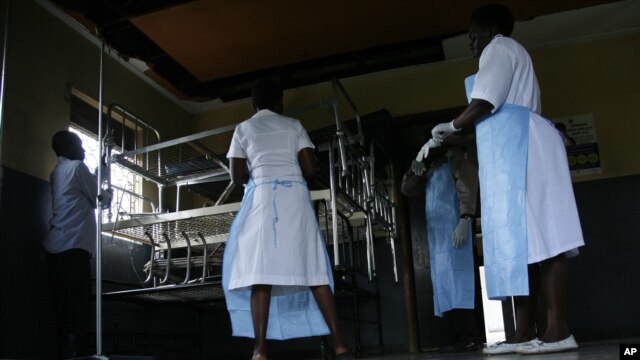 Medical personal prepare a ward following new Ebola outbreak, November 15, 2012. 