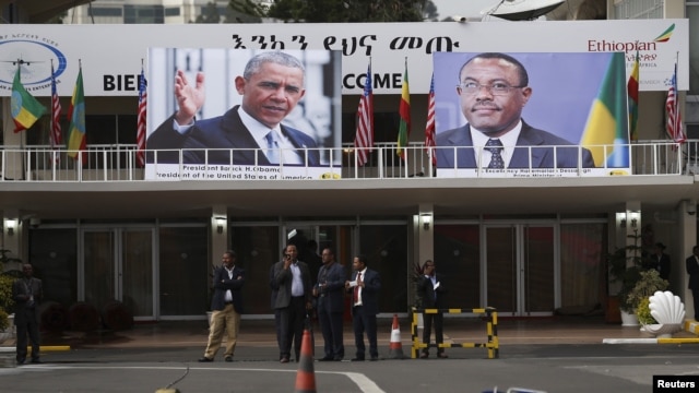 Portraits of U.S. President Barack Obama (L) and Ethiopia's Prime Minister Hailemariam Desalegn (R) decorate the airport terminal as Obama arrives aboard Air Force One at Bole International Airport in Addis Ababa, Ethiopia, July 26, 2015.