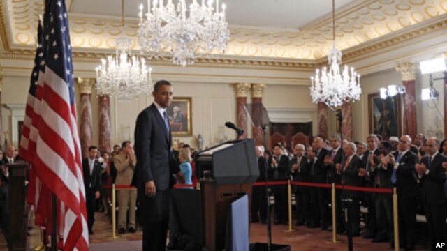 U.S. President Barack Obama receives a standing ovation after a speech about the United States' policy on the Middle East and North Africa at the State Department in Washington, May 19, 2011.