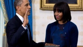 President Obama takes the oath of office at the official swearing-in ceremony in the Blue Room of the White House, January 20, 2013. 