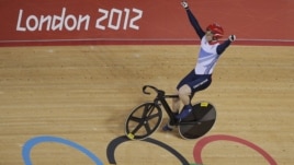 Britain's Jason Kenny celebrates after winning the gold medal in the track cycling men's sprint event, during the 2012 Summer Olympics in London, Monday, Aug. 6, 2012.