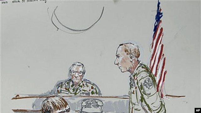 In this courtroom sketch, U.S. Army Cpl. Jeremy Morlock of Wasilla, Alaska, center, is shown as Col. Thomas Molloy, right, the investigating officer, and Morlock's attorney, Michael Waddington, left, look on, at Joint Base Lewis-McChord, Washington, Septe