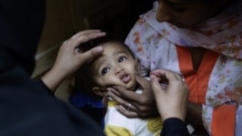 Child receives a polio vaccine in Islamabad, Pakistan, Oct. 16, 2012.