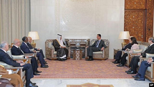 Syrian President Bashar al-Assad, center right, meets with Qatari Prime Minister Sheikh Hamad bin Jassim Bin Jabr al-Thani, center left, Damascus, Oct. 26, 2011.