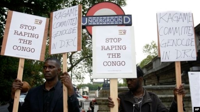 Protesters stand outside Arundel House where President of the Republic of Rwanda, Paul Kagame, deliverers the annual Oppenheimer Lecture, London, Sept. 16, 2010.