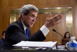 FILE - Secretary of State John Kerry promises a decision soon on whether the Islamic State is committing genocide.