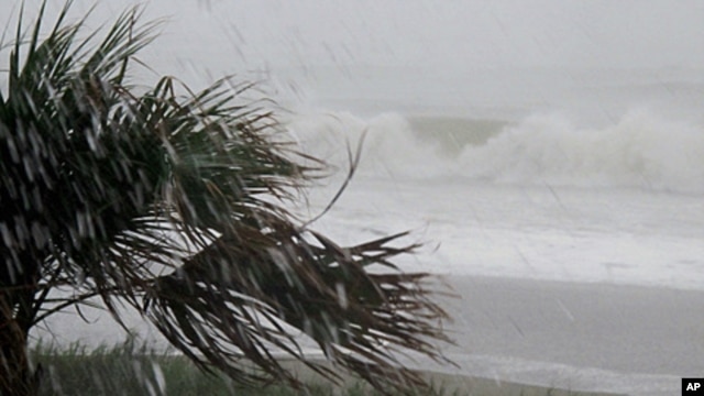 Rains and waves from Hurricane Irene batter the shore in downtown Myrtle Beach, South Carolina, August 26, 2011
